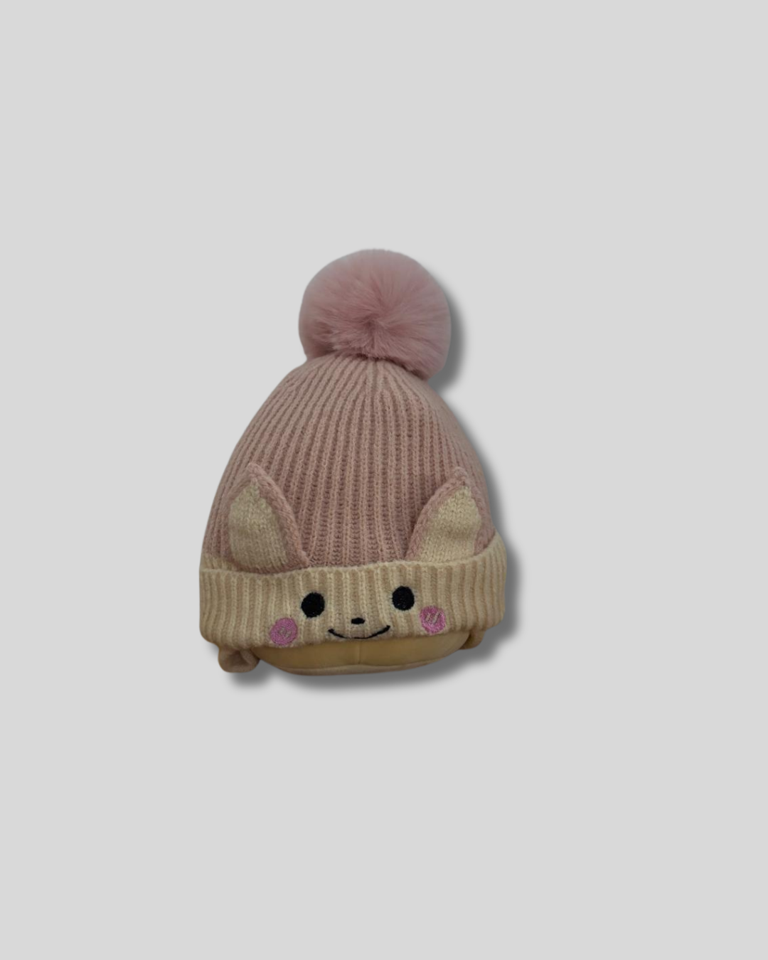 Gorro tejido con borla rosado